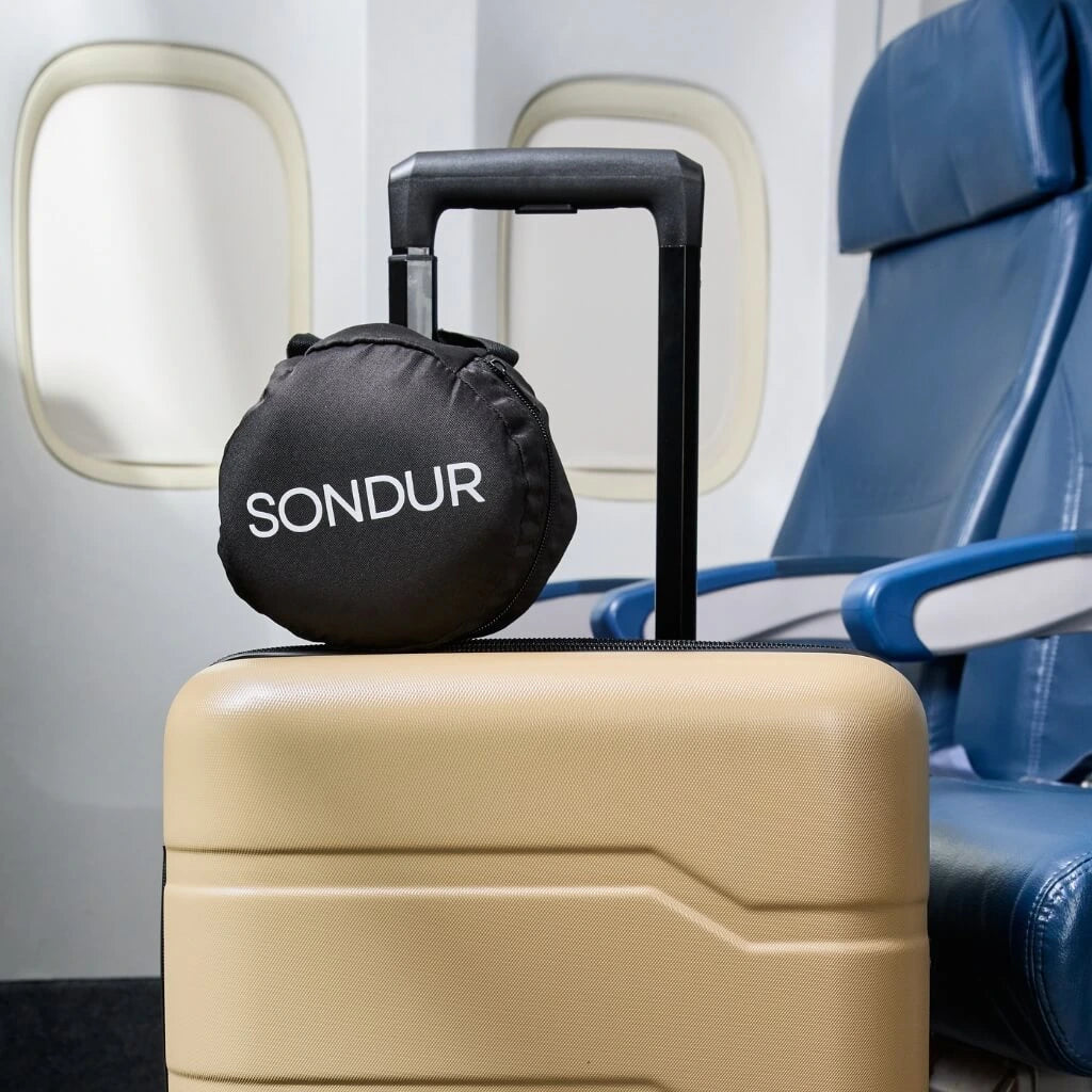 Sondur cushion carry bag on a suitcase